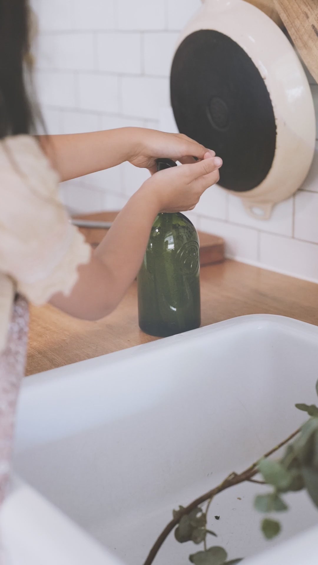 A little girl washing her hands with koala Eco hands wash
